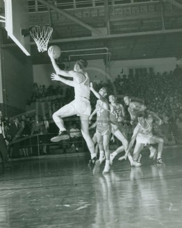 Full House At Joe Perkins Watches Roy Pugh Drive For Layup Against Texas